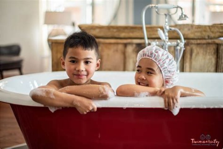 At what age should a mother stop showering with her son?