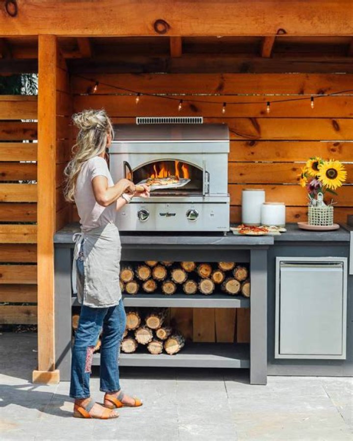 Can you burn wood in a gas pizza oven?