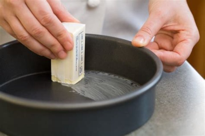 Do you need to grease the sides of a cake pan?