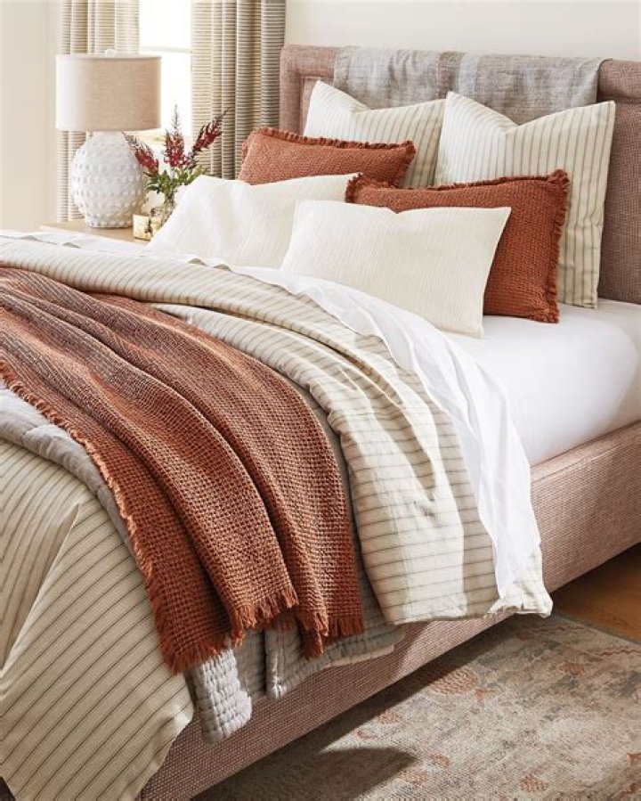 How can I make my bed look more expensive?