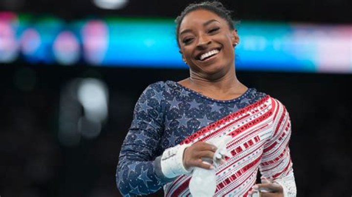 How does Simone Biles get paid?