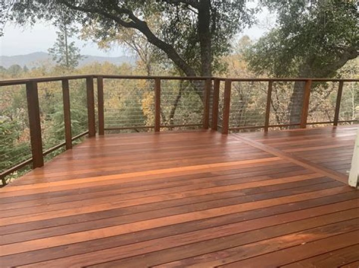 Is it better to stain or seal a deck?
