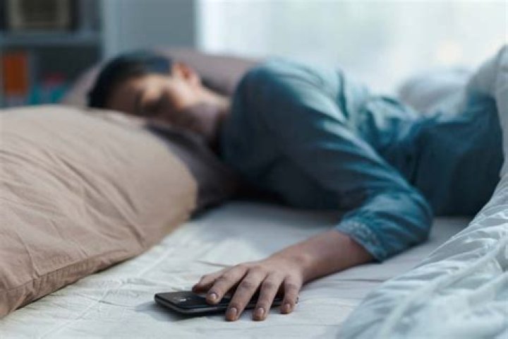 Should you sleep with your phone next to your head?