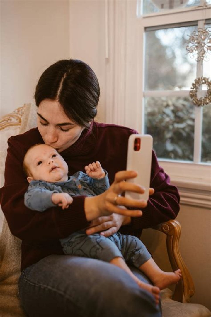 What age does baby give kisses?