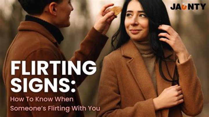 What are the signs of a woman flirting?