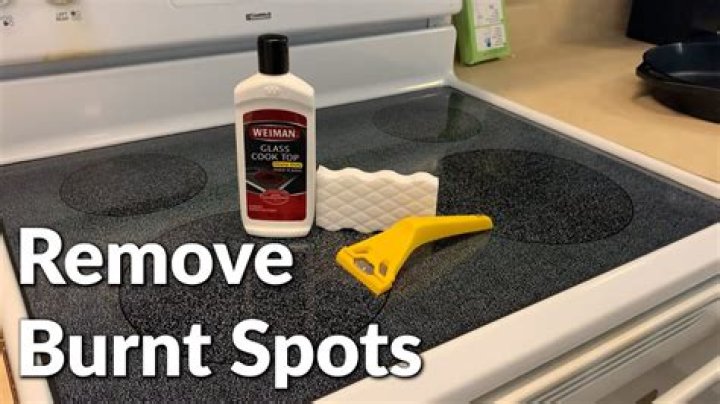 What cleans burnt glass?