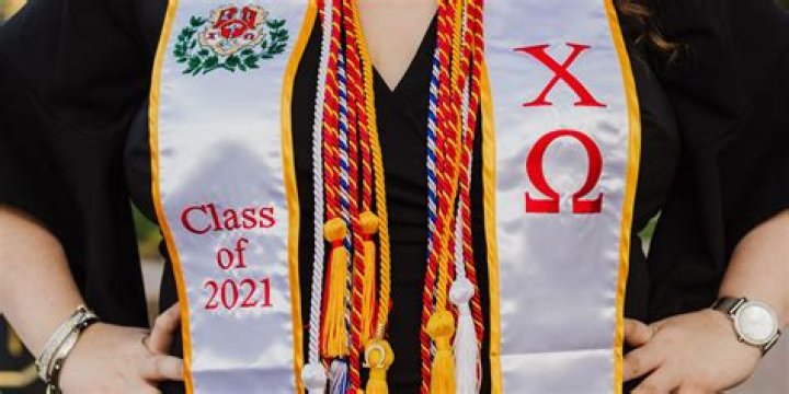 What does the gold sash mean at graduation?