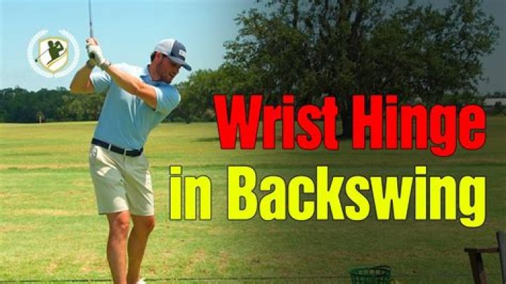When should the wrist hinge in the backswing?