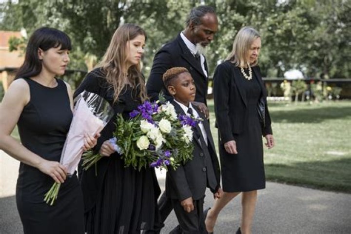 Where does an ex wife sit at a funeral?