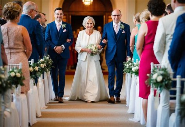 Who walks the groom's mother?