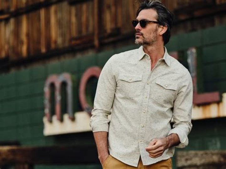 Why do cowboys wear button down shirts?
