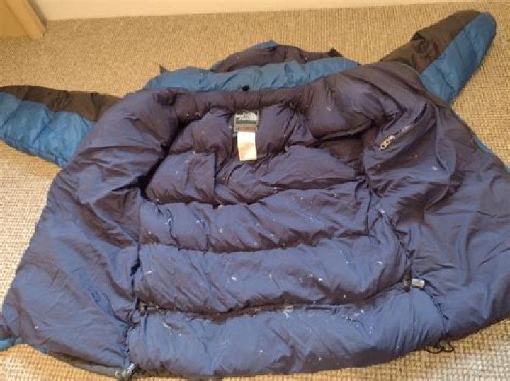 Why do feathers come out of my down jacket?