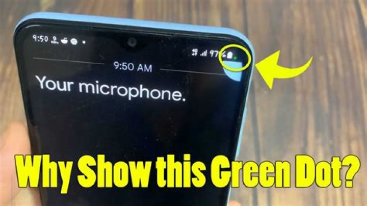 Why is there green dot on my iPhone?