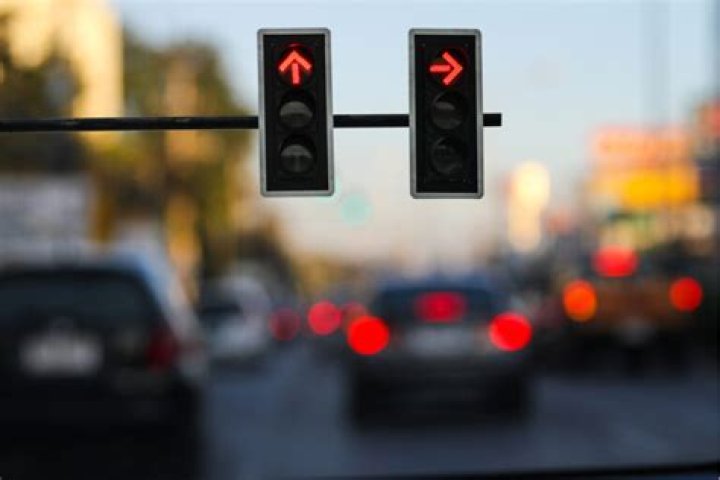 Will I get a red light ticket for going over the white line but still stopped UK?